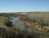 Vista panorámica del entorno con imagen de la Villa de Materno al fondo